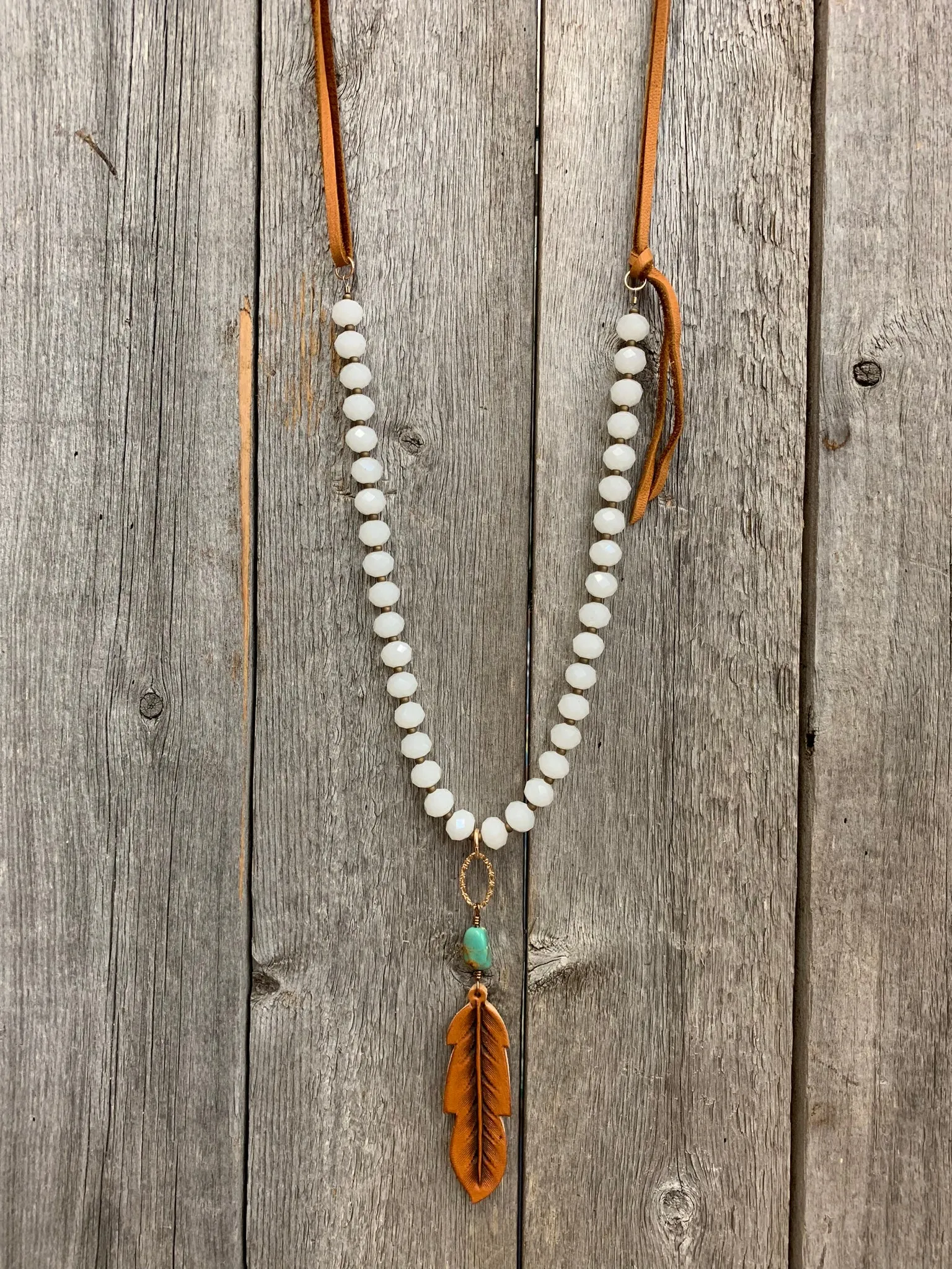 16612 Wht Crystal w/Turq & Lthr Feather