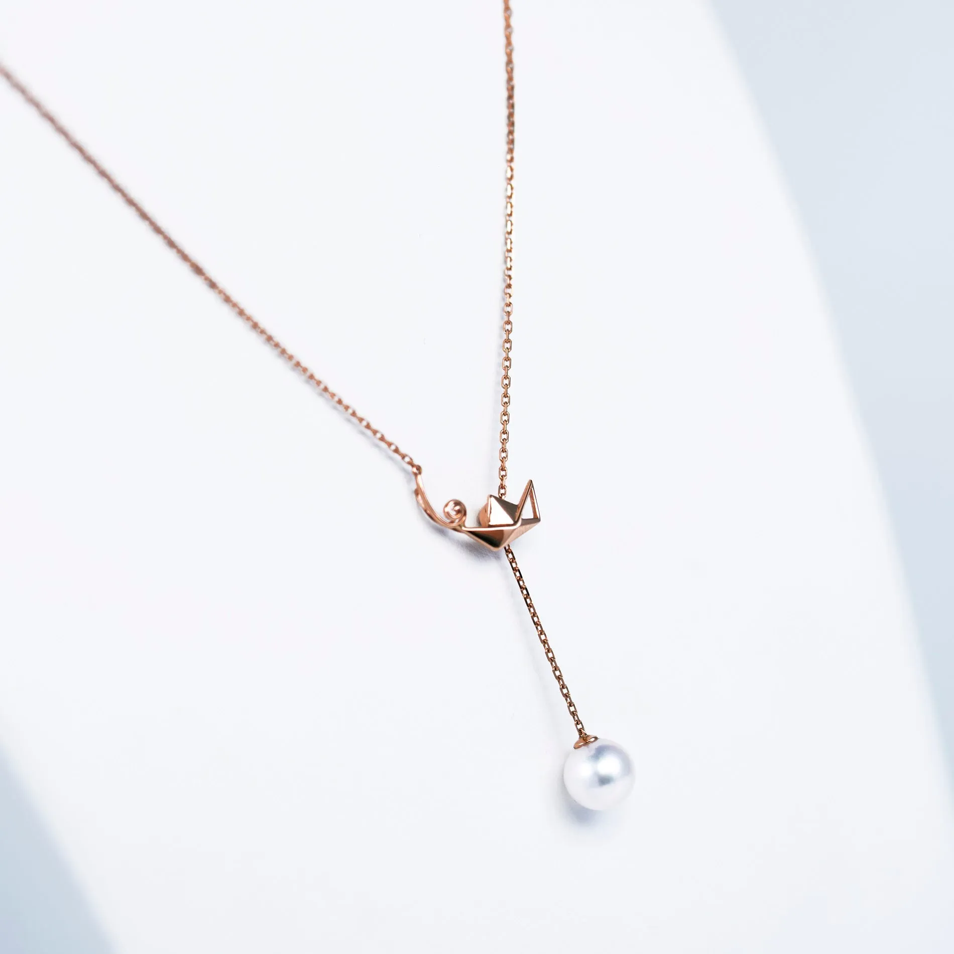 "Origaminx Boat" 18K gold and Akoya pearl, origami-shaped necklace